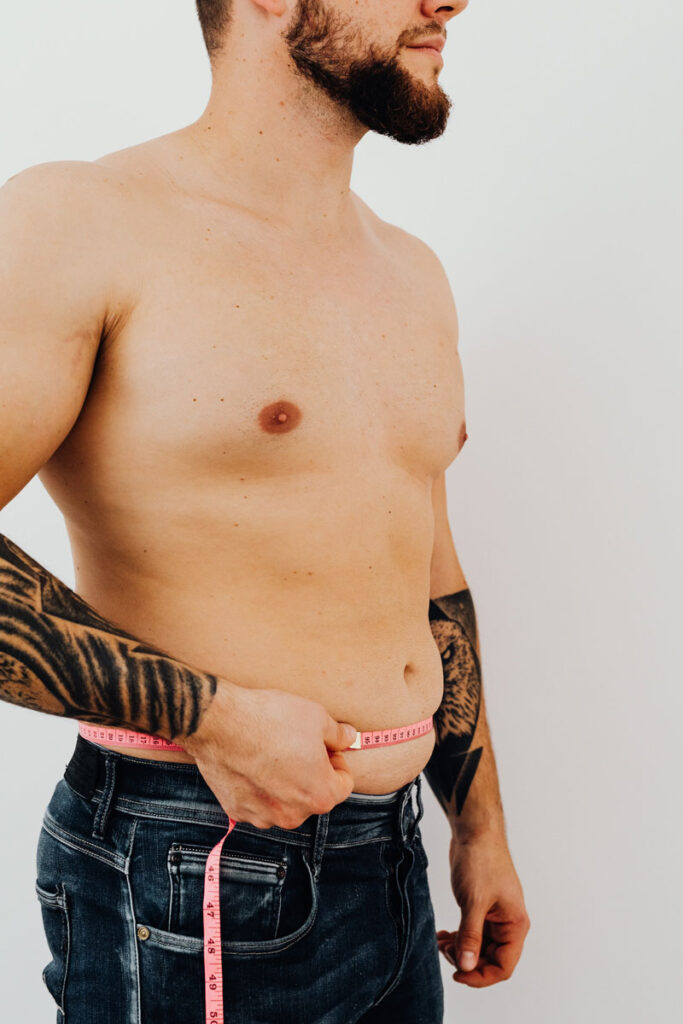 photo of measuring tape around a man's waist